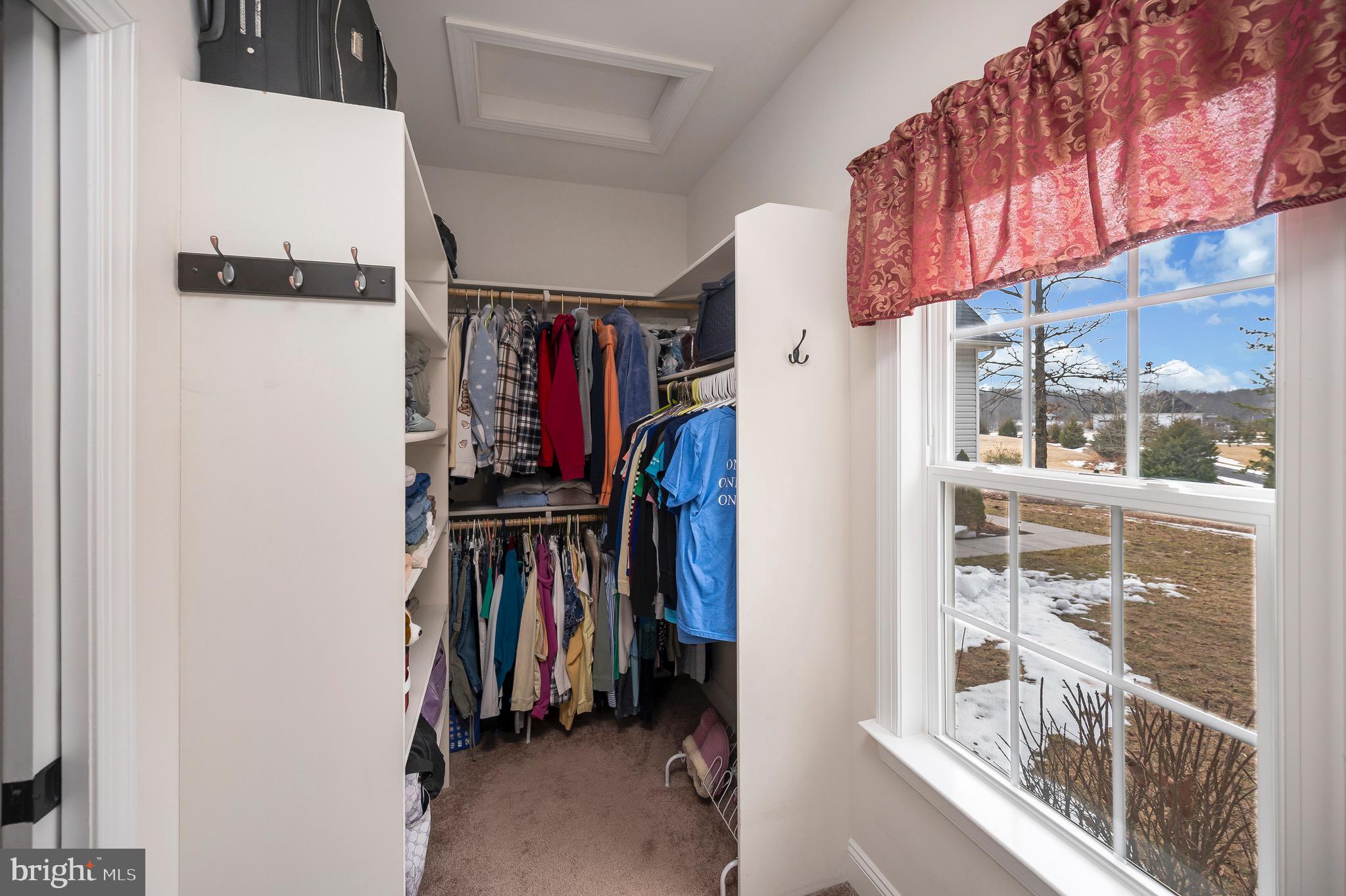 23145 Walker's Branch Road Unionville, VA 22567 - Photo 29 of 48 a view of walk in closet with clothes and shoes