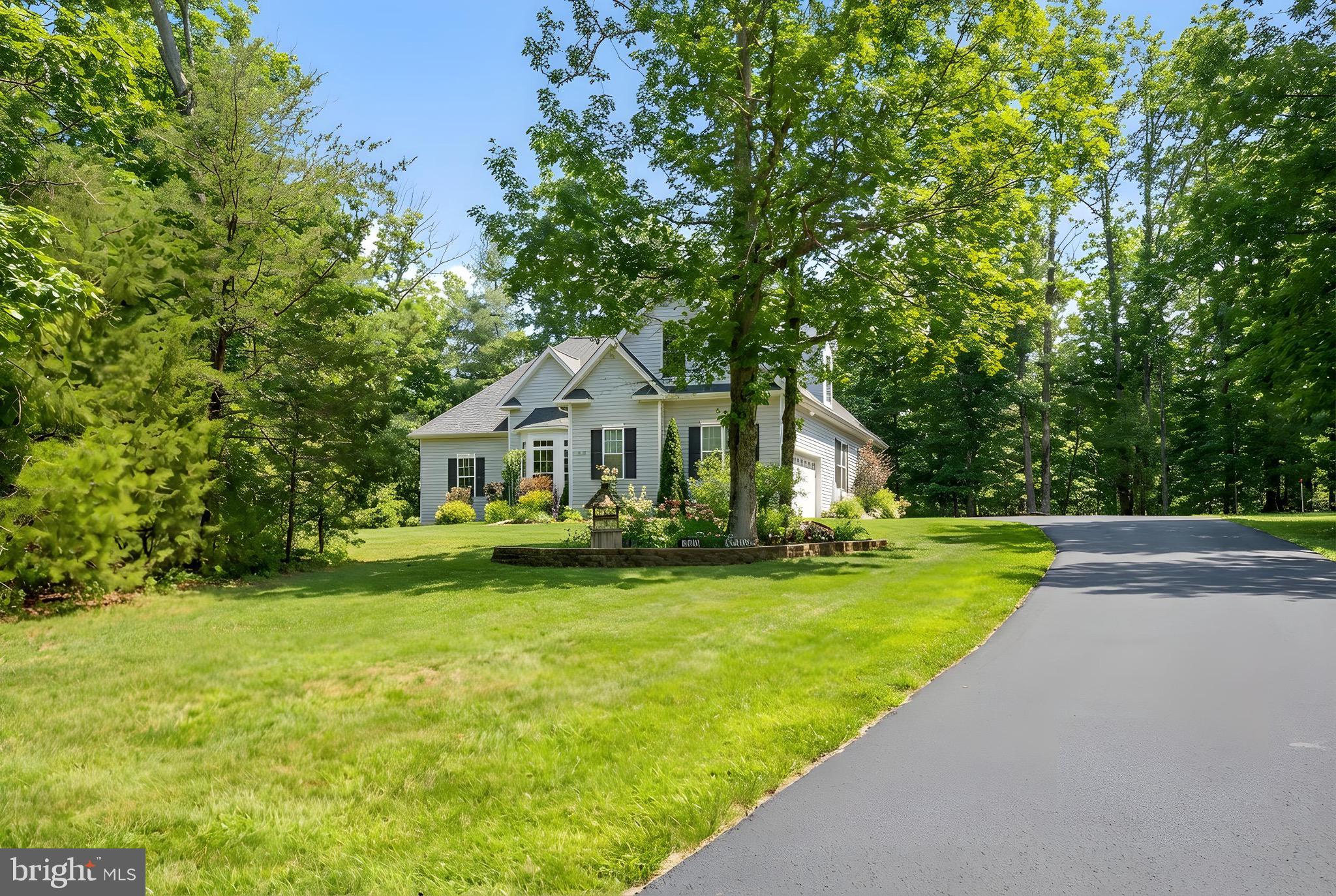 23145 Walker's Branch Road Unionville, VA 22567 - Photo 45 of 48 a front view of a house with garden