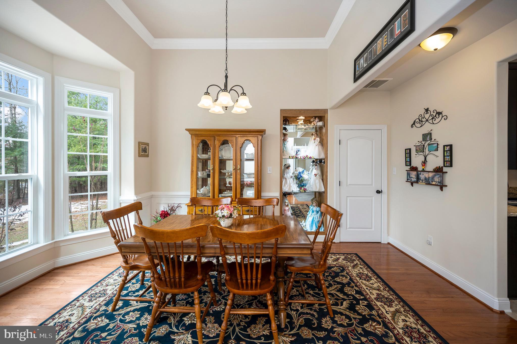 23145 Walker's Branch Road Unionville, VA 22567 - Photo 7 of 48 a view of a dining room with furniture window and wooden floor