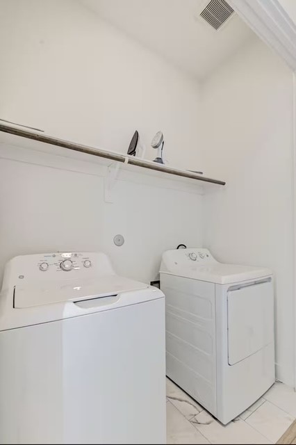 5910 Val Verde Street Houston, TX 77057 - Photo 11 of 21 a utility room with dryer and washer