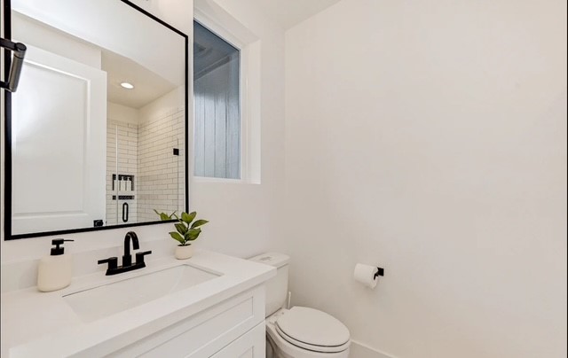 5910 Val Verde Street Houston, TX 77057 - Photo 12 of 21 a bathroom with a sink toilet and vanity