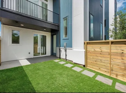 a view of a backyard of the house