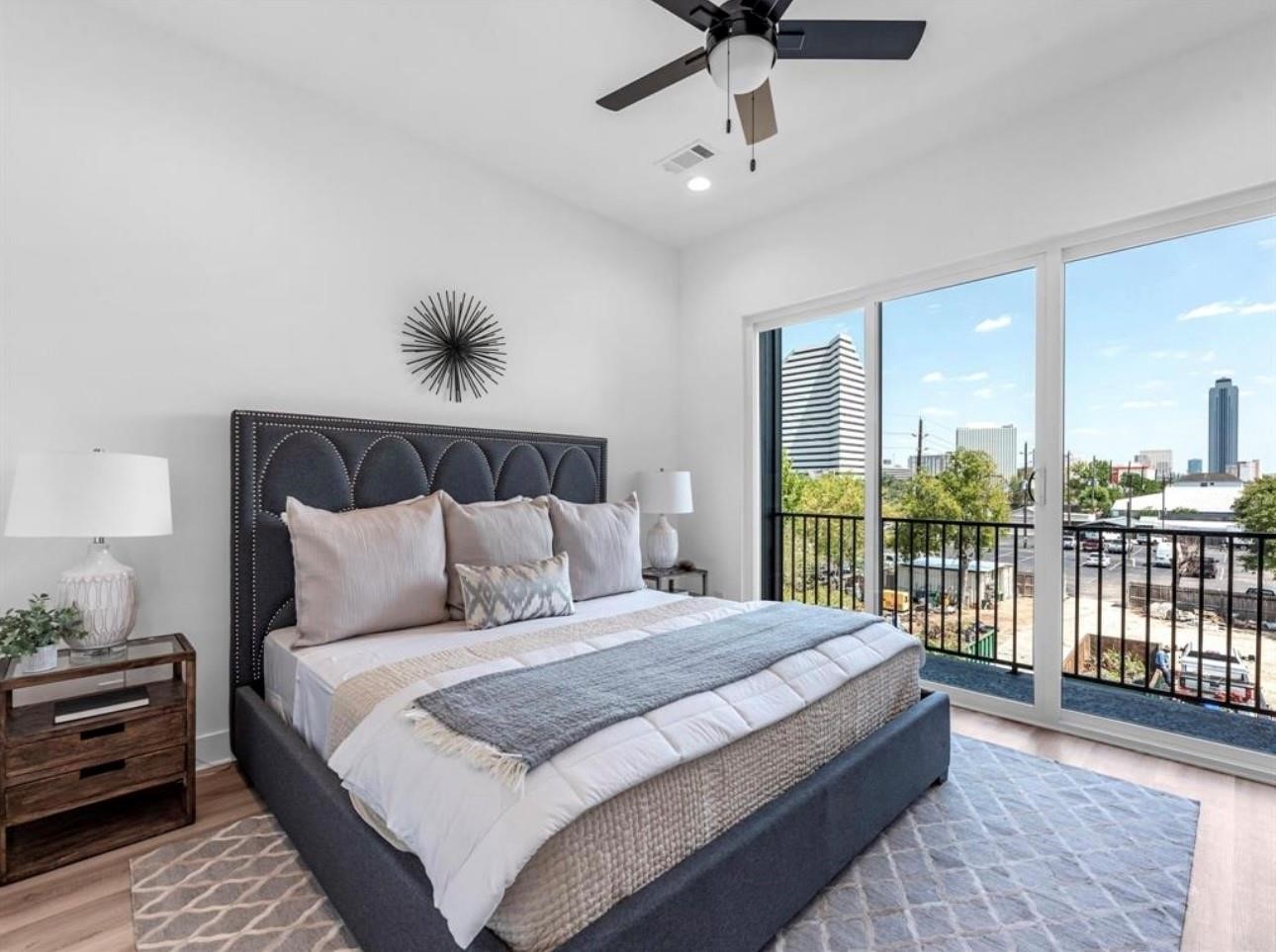 5910 Val Verde Street Houston, TX 77057 - Photo 3 of 21 a bedroom with a large bed and a chandelier