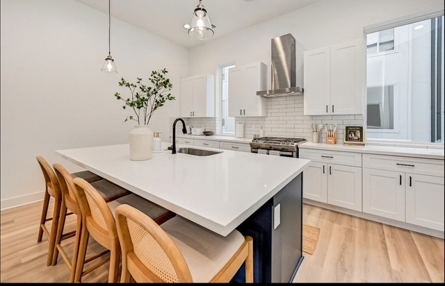 5910 Val Verde Street Houston, TX 77057 - Photo 9 of 21 a kitchen with stainless steel appliances a sink and cabinets