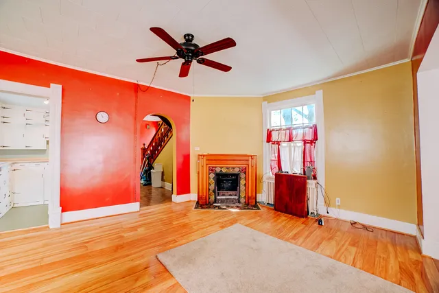 a living room with furniture a dining table with wooden floor
