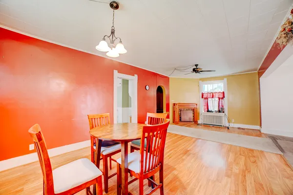 a dining room with furniture and window
