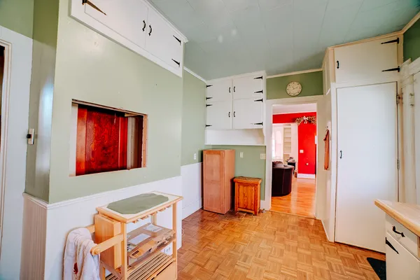a bathroom with a sink mirror and toilet