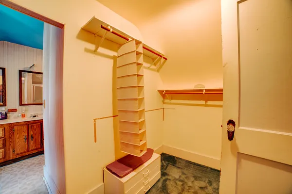 a view of a door and wooden floor