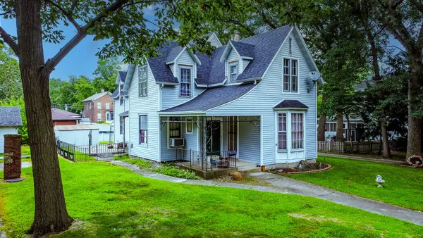 front view of a house with a yard