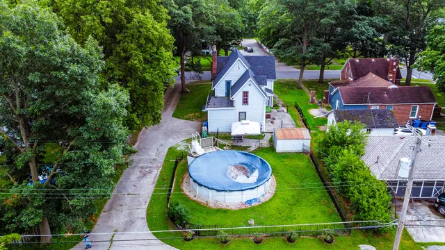 an aerial view of a house with garden space and a garden