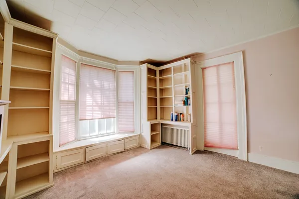 a view of an empty room with a window