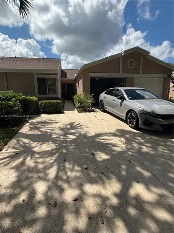 a view of a car in front of a building