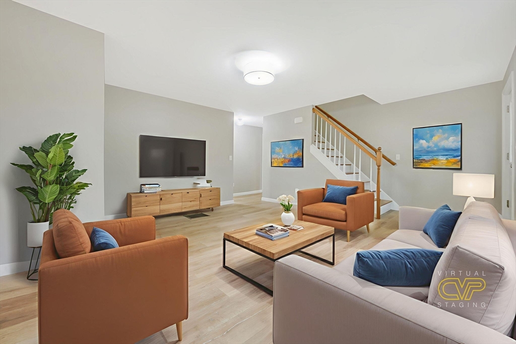 599 Quanapoag Road Dartmouth, MA 02747 - Photo 13 of 32 a living room with furniture and a flat screen tv