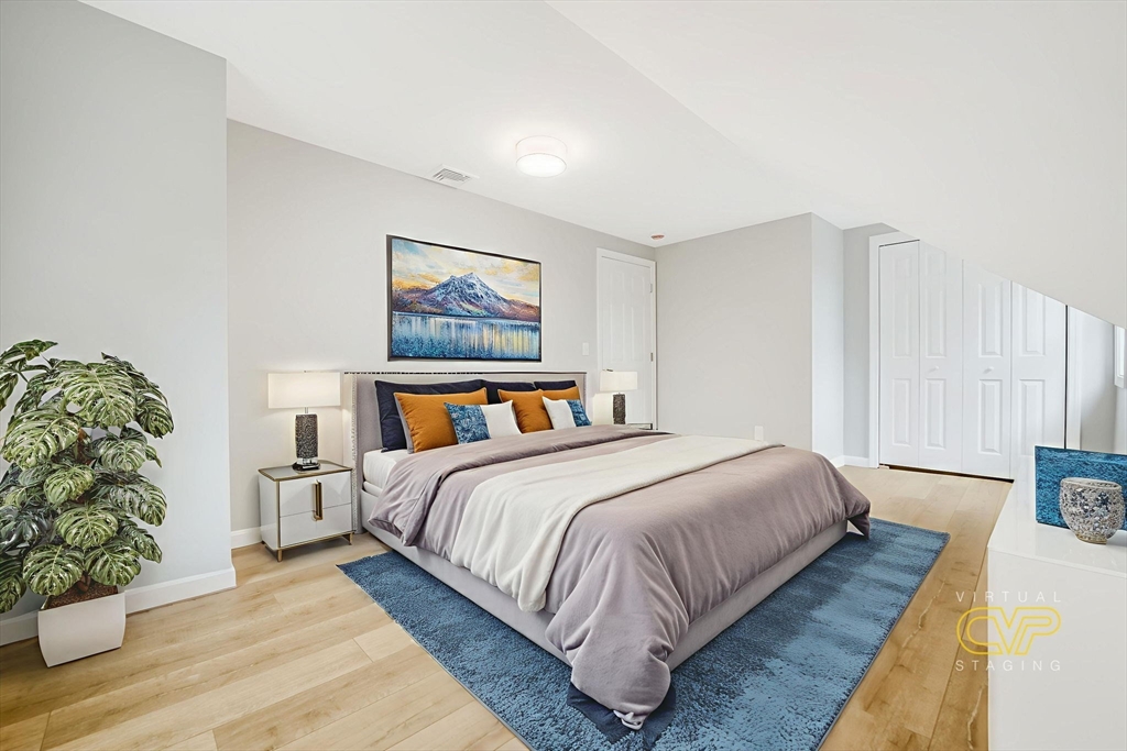 599 Quanapoag Road Dartmouth, MA 02747 - Photo 26 of 32 a bedroom with bed and a painting on the wall