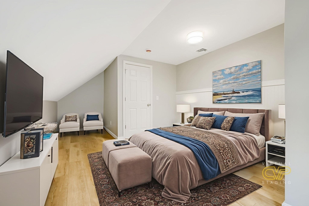 599 Quanapoag Road Dartmouth, MA 02747 - Photo 30 of 32 a bedroom with bed and a flat screen tv