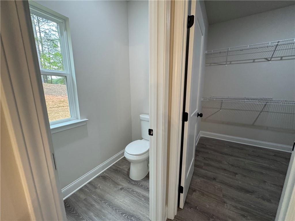 2113 North Hicks Road Toccoa, GA 30577 - Photo 15 of 28 a bathroom with a toilet and a shower
