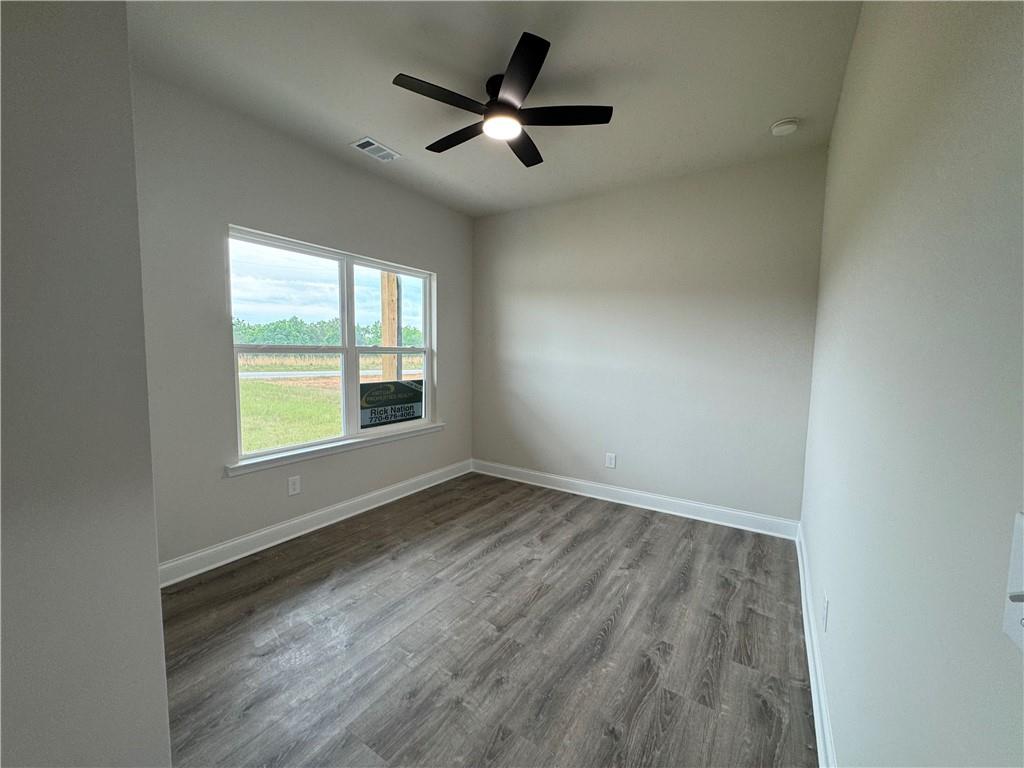 2113 North Hicks Road Toccoa, GA 30577 - Photo 21 of 28 wooden floor in an empty room with a window