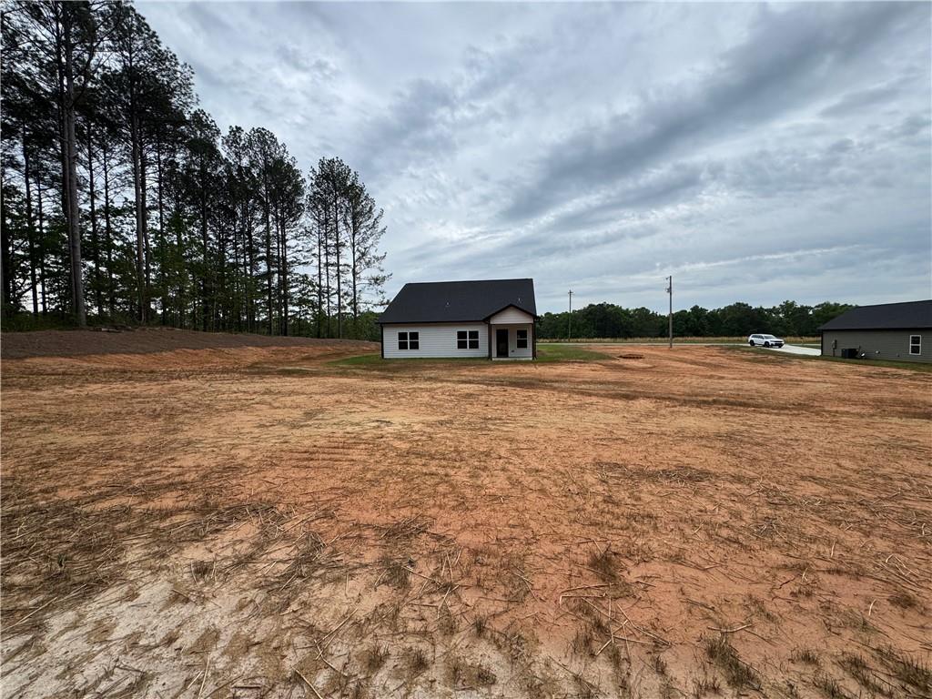 2113 North Hicks Road Toccoa, GA 30577 - Photo 28 of 28 a view of swimming pool with lawn chairs and wooden fence