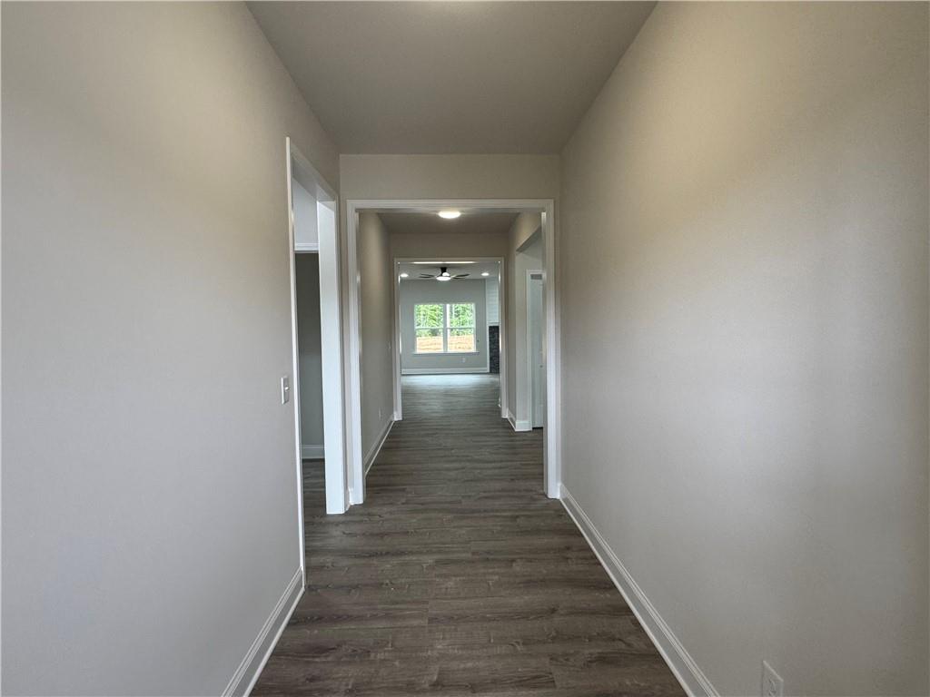 2113 North Hicks Road Toccoa, GA 30577 - Photo 3 of 28 a view of a hallway with wooden floor