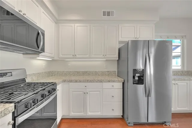 a view of a hallway with washer and dryer