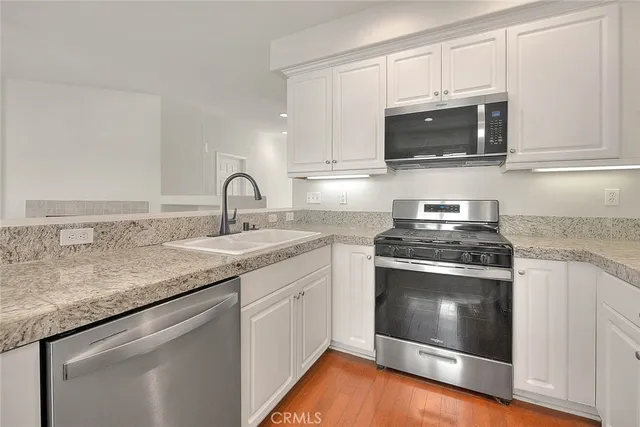 a spacious bathroom with a toilet a sink and a bathtub