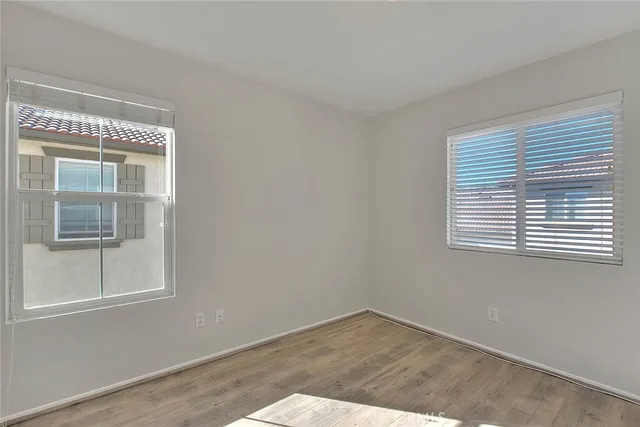 a bathroom with a tub a sink and a window