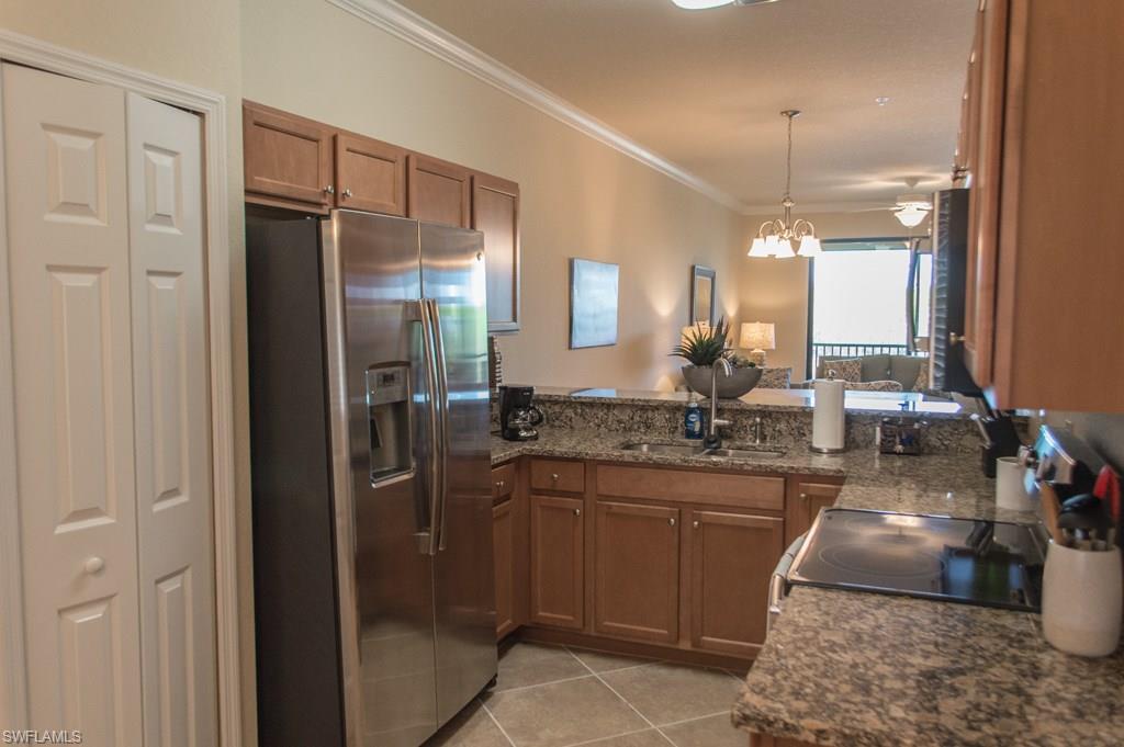 9566 Trevi Court, Unit 4943 Naples, FL 34113 - Photo 16 of 47 a bathroom with a sink a toilet and shower