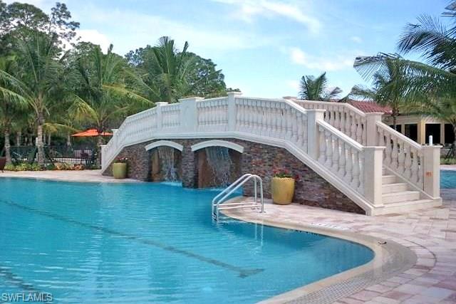 9566 Trevi Court, Unit 4943 Naples, FL 34113 - Photo 20 of 33 a front view of a house with garden