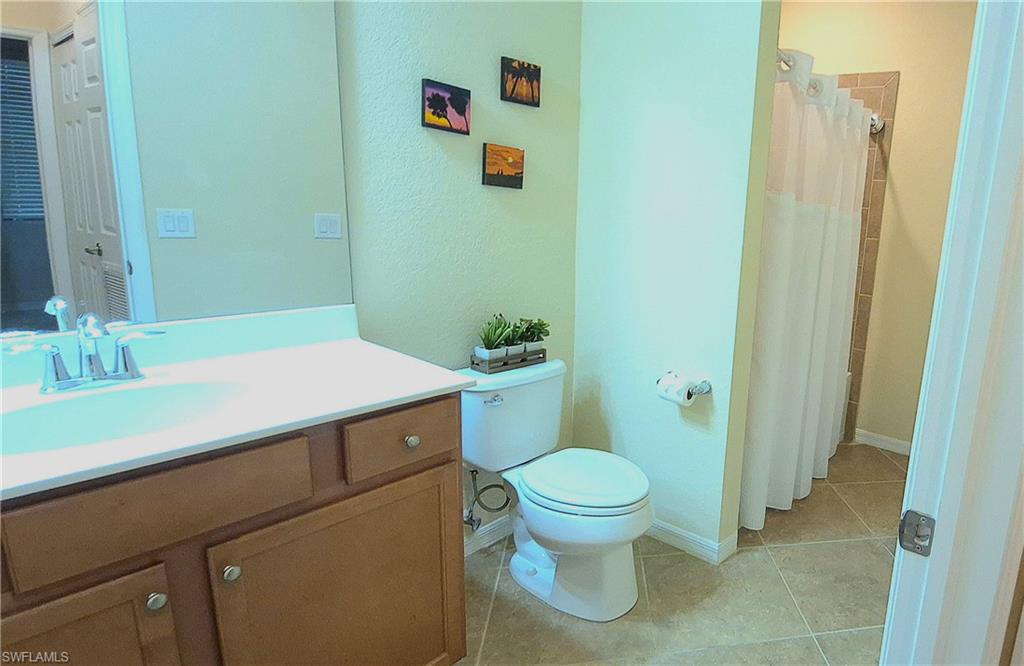 9566 Trevi Court, Unit 4943 Naples, FL 34113 - Photo 22 of 47 a bathroom with a sink and a toilet