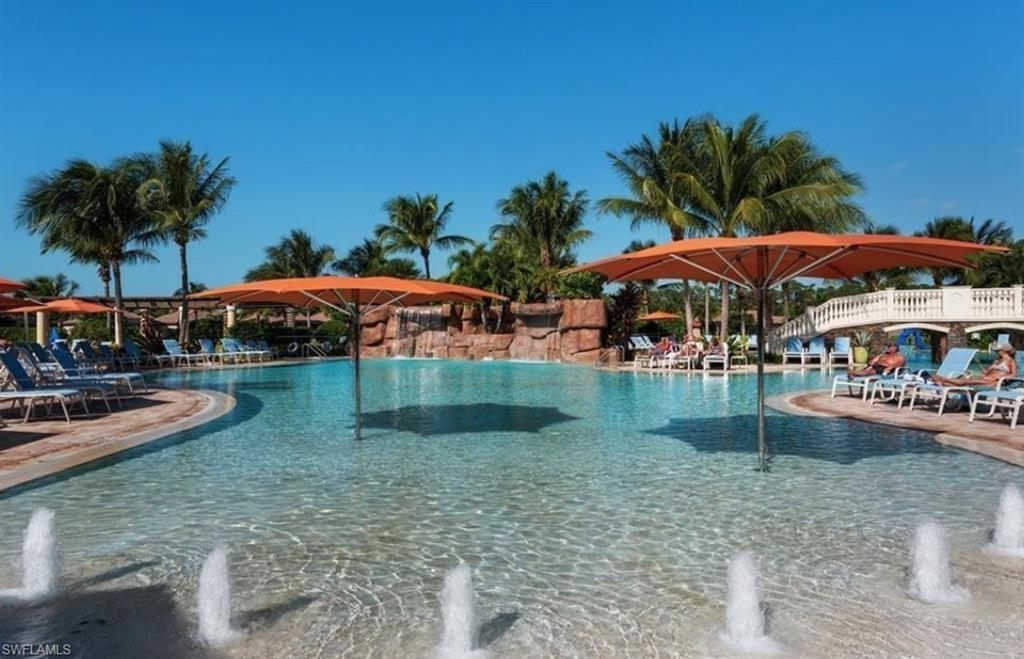 9566 Trevi Court, Unit 4943 Naples, FL 34113 - Photo 23 of 33 an outdoor space with pool and furniture