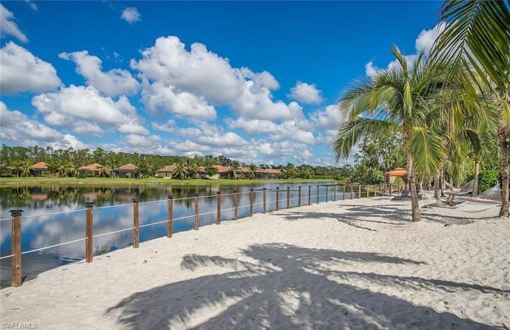 9566 Trevi Court, Unit 4943 Naples, FL 34113 - Photo 37 of 47 a view of a lake with a houses