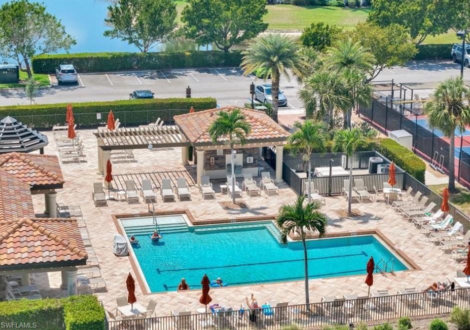 9566 Trevi Court, Unit 4943 Naples, FL 34113 - Photo 45 of 47 an aerial view of a house with a garden and lake view