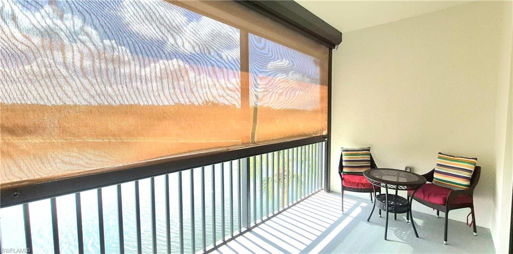9566 Trevi Court, Unit 4943 Naples, FL 34113 - Photo 5 of 47 a view of a balcony with furniture