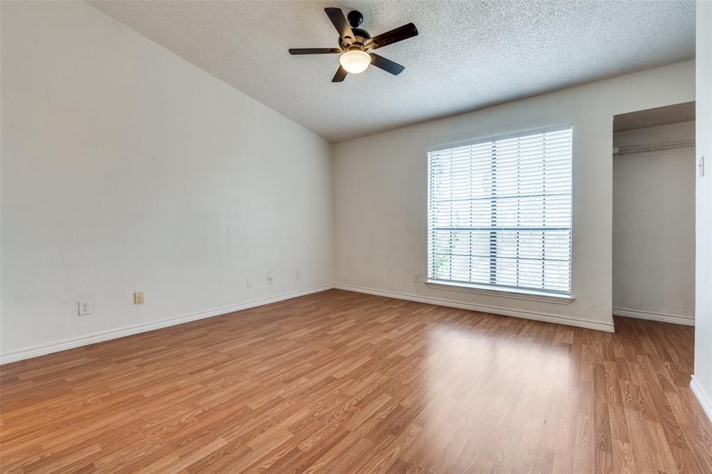 11655 Audelia Road, Unit 901 Dallas, TX 75243 - Photo 19 of 23 wooden floor in an empty room with a window