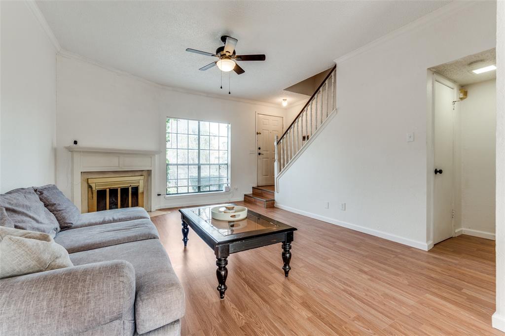 11655 Audelia Road, Unit 901 Dallas, TX 75243 - Photo 4 of 23 a living room with furniture and a fireplace