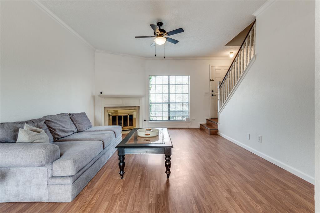 11655 Audelia Road, Unit 901 Dallas, TX 75243 - Photo 5 of 23 a living room with furniture and a fireplace