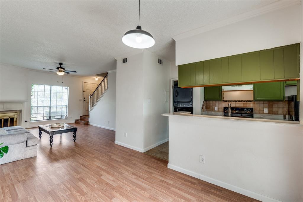 11655 Audelia Road, Unit 901 Dallas, TX 75243 - Photo 8 of 23 a living room with furniture and a flat screen tv