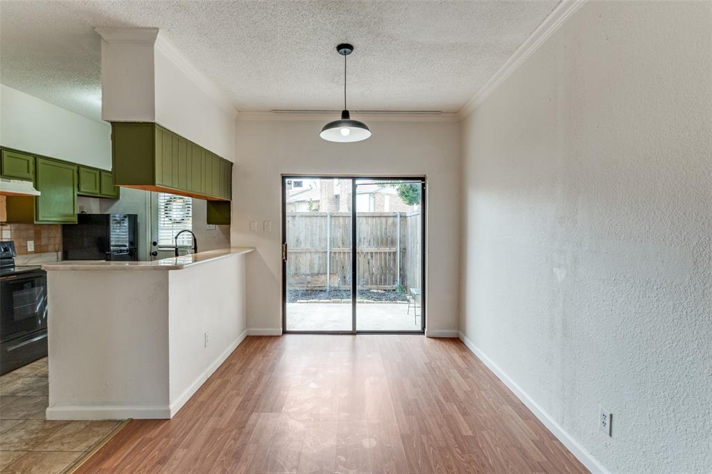 11655 Audelia Road, Unit 901 Dallas, TX 75243 - Photo 9 of 23 a view of a kitchen from the hallway