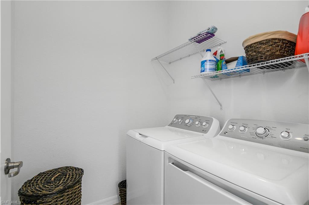 2215 Dragonfruit Way Naples, FL 34120 - Photo 16 of 30 a utility room with dryer and washer