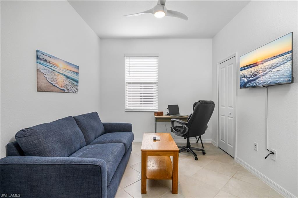 2215 Dragonfruit Way Naples, FL 34120 - Photo 21 of 30 a living room with furniture and a window