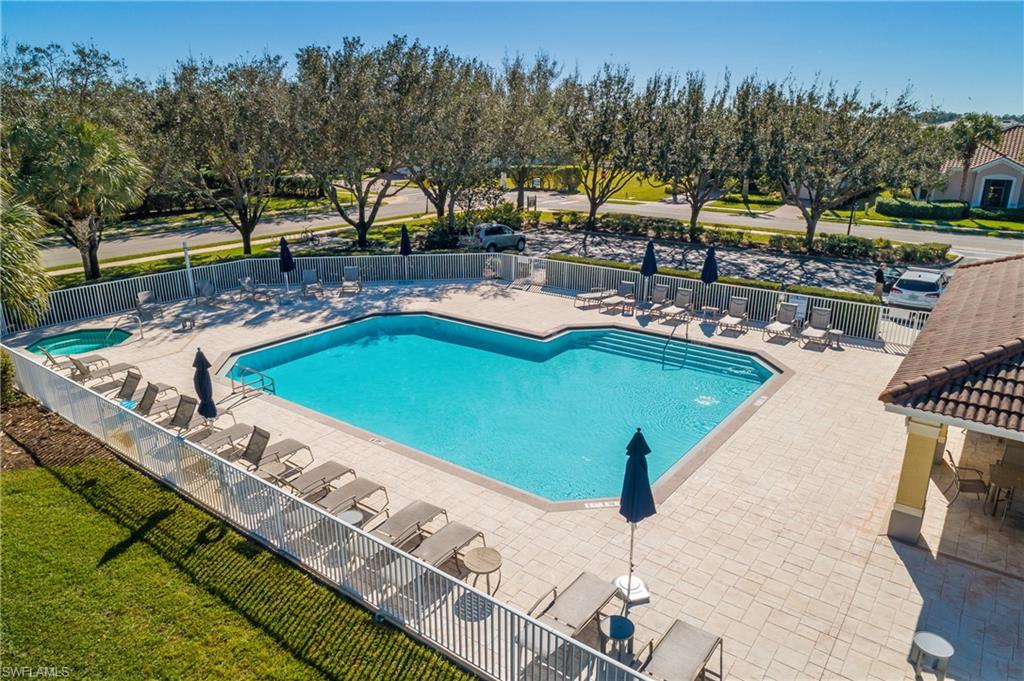 2215 Dragonfruit Way Naples, FL 34120 - Photo 30 of 30 a view of a swimming pool with a patio and a yard