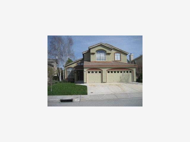 a picture of a bench in front of a building