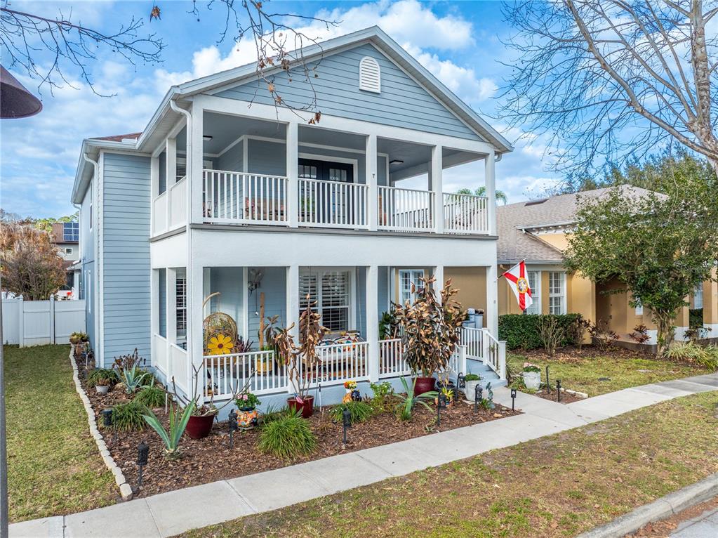 6911 Beargrass Road Harmony, FL 34773 - Photo 3 of 60 a front view of a house with garden