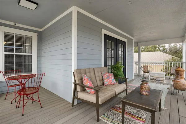 a swimming pool with outdoor seating and yard