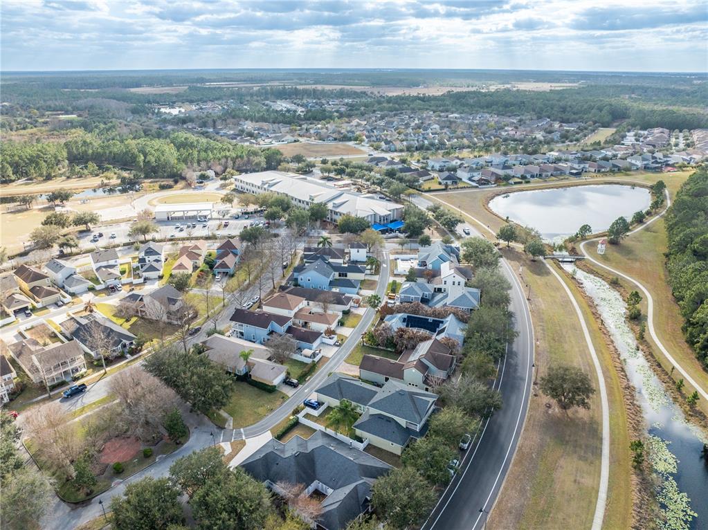 6911 Beargrass Road Harmony, FL 34773 - Photo 43 of 60 an aerial view of residential houses with outdoor space