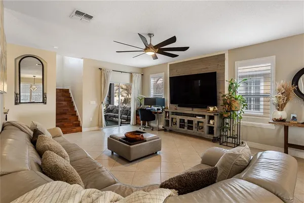 a living room with furniture and a flat screen tv
