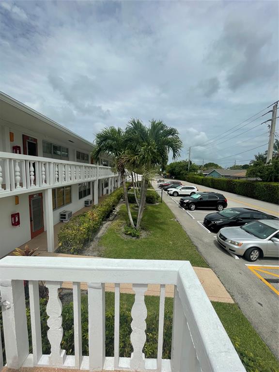 387 Tilford R, Unit 387 Deerfield Beach, FL 33442 - Photo 14 of 53 a balcony with furniture and garden