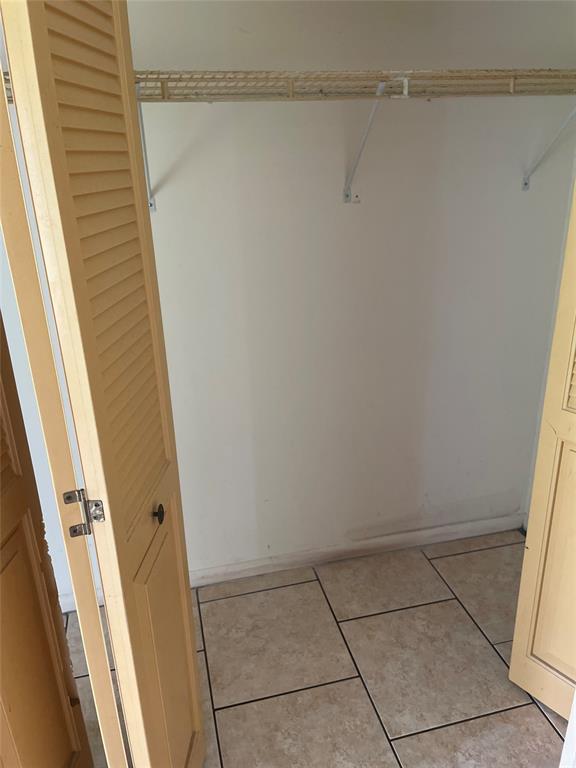 387 Tilford R, Unit 387 Deerfield Beach, FL 33442 - Photo 8 of 53 a view of small space with racks on the wall