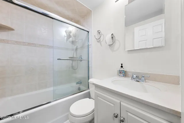 a bathroom with a sink a toilet and a bathtub