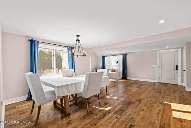 a view of a dining room with furniture and window